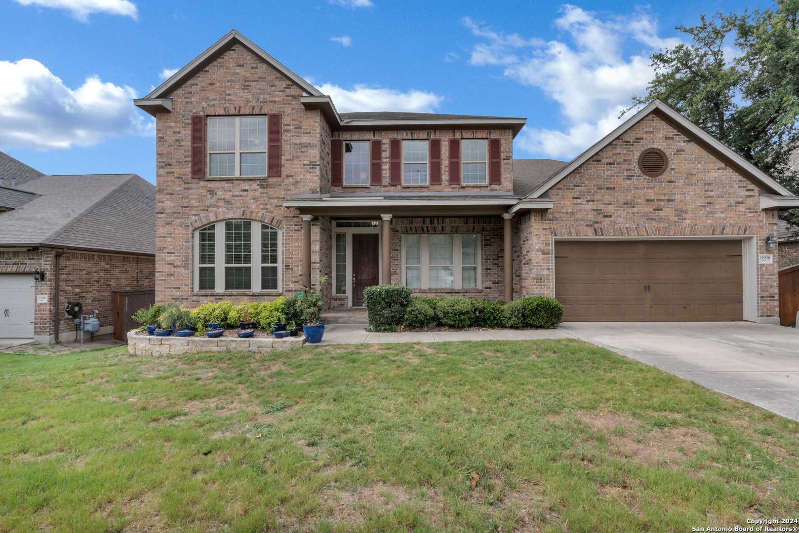 a front view of a house with a yard