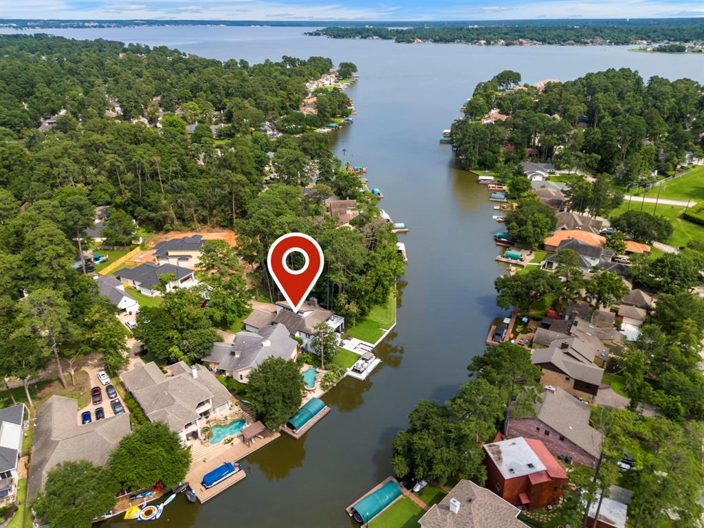 an aerial view of residential house with outdoor space and lake view