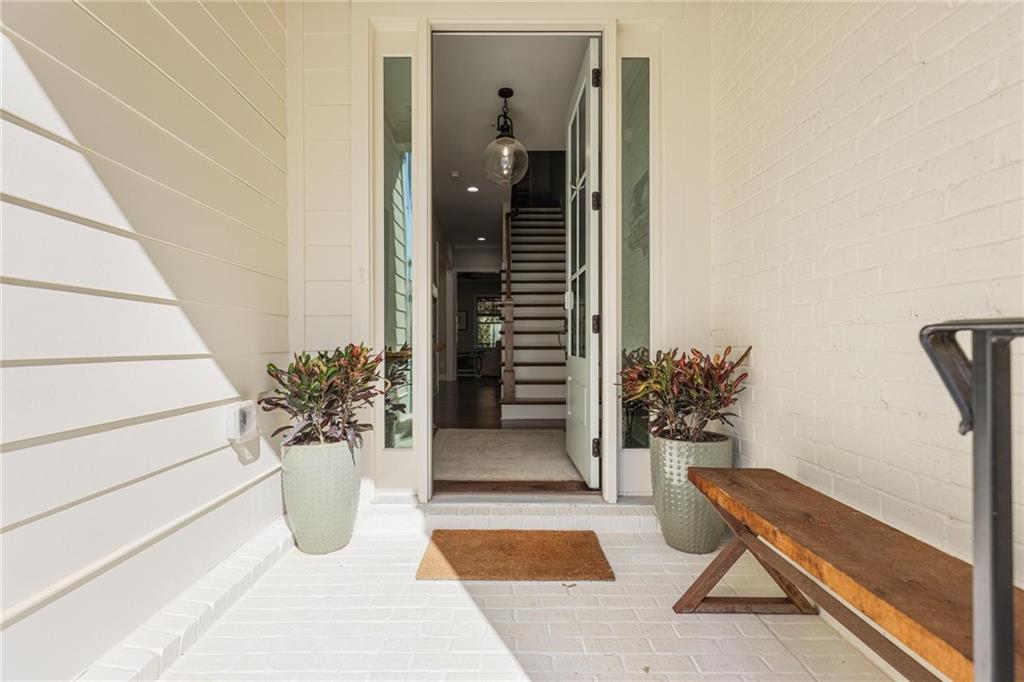 a potted plant sitting in front of a door