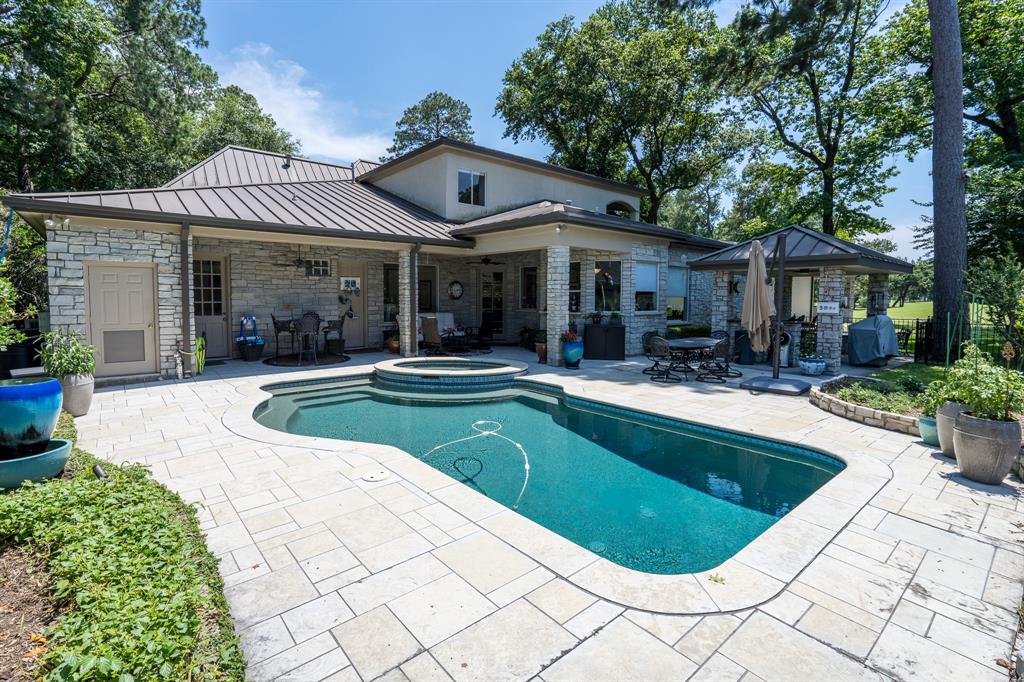 Welcome to 5906 Southern Hills Drive where you will find this sparkling pool with hot tub and Pebble Tech siding.