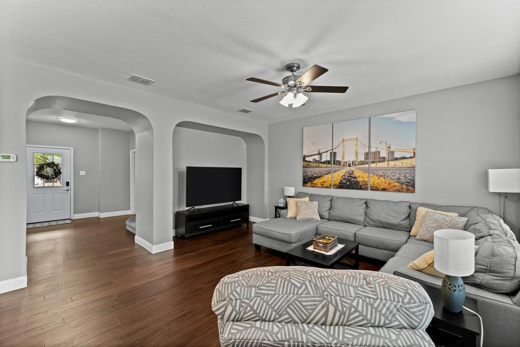 a bedroom with furniture and a flat screen tv