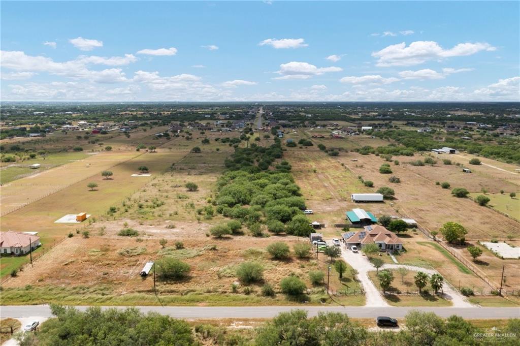 Birds eye view of property with a rural view