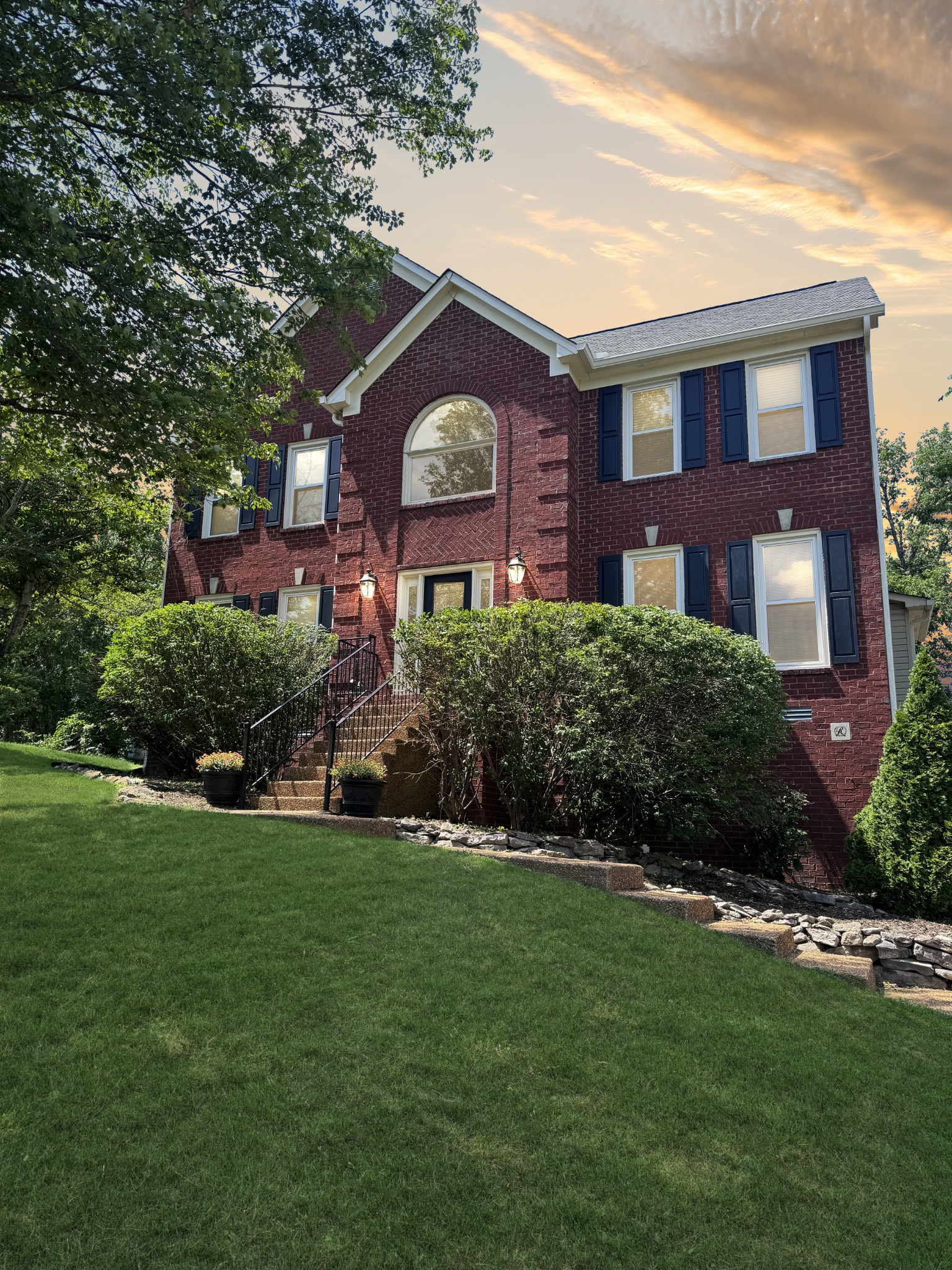 a front view of a house with a yard