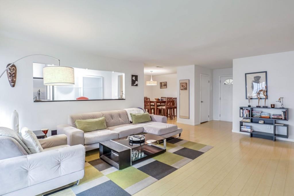 a living room with furniture and a table