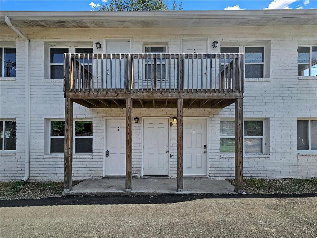 a front view of a house with a porch