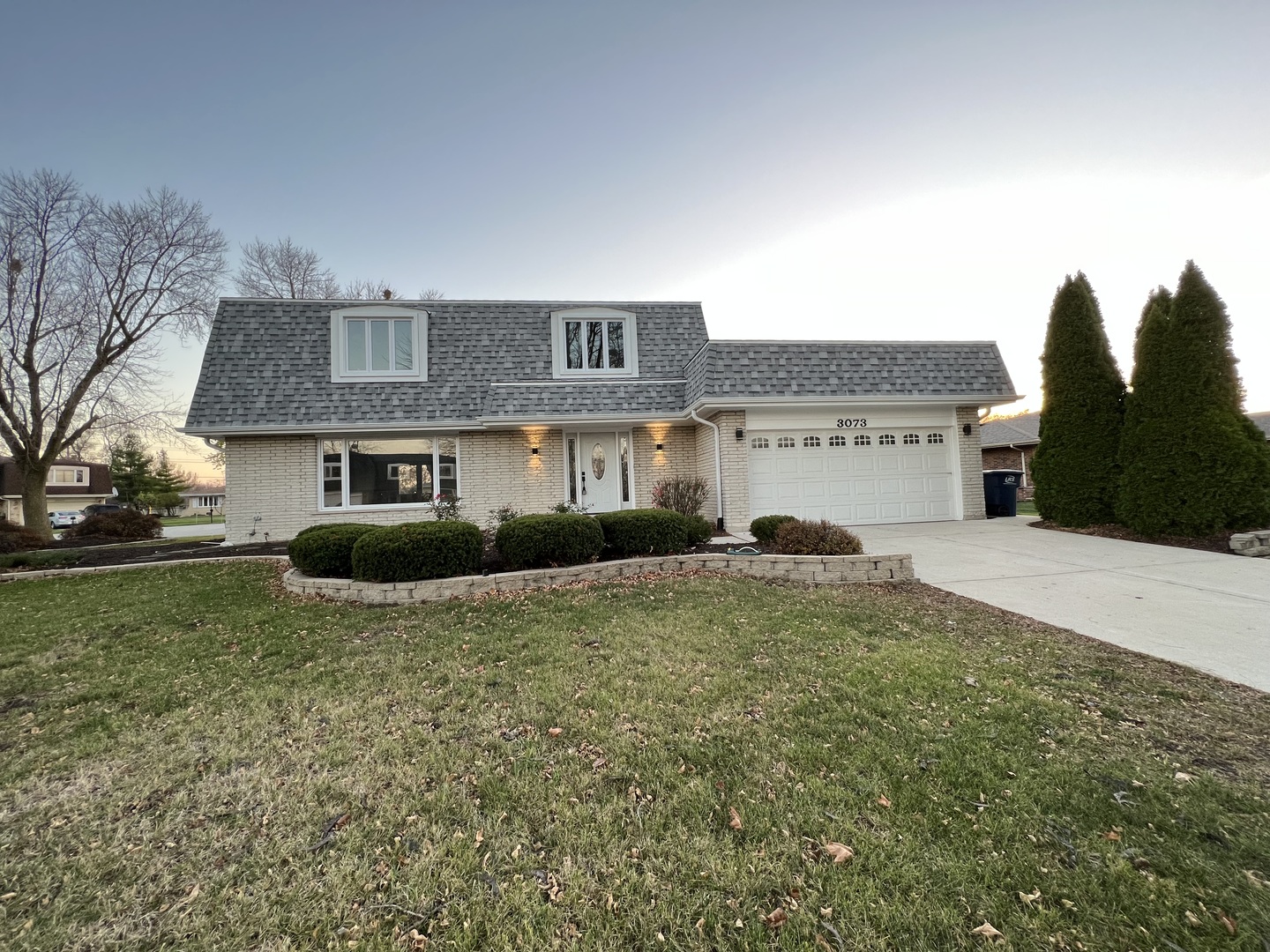 a front view of a house with a yard