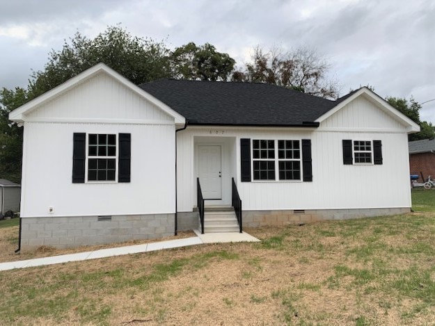 a front view of a house with a garage