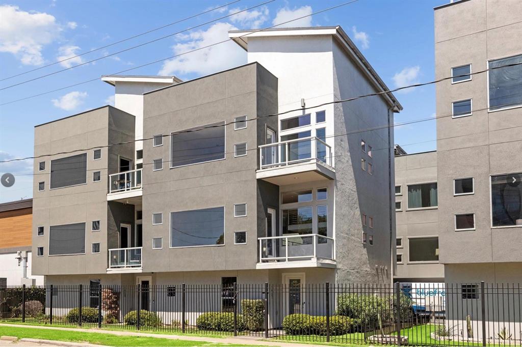 a view of a building with a yard