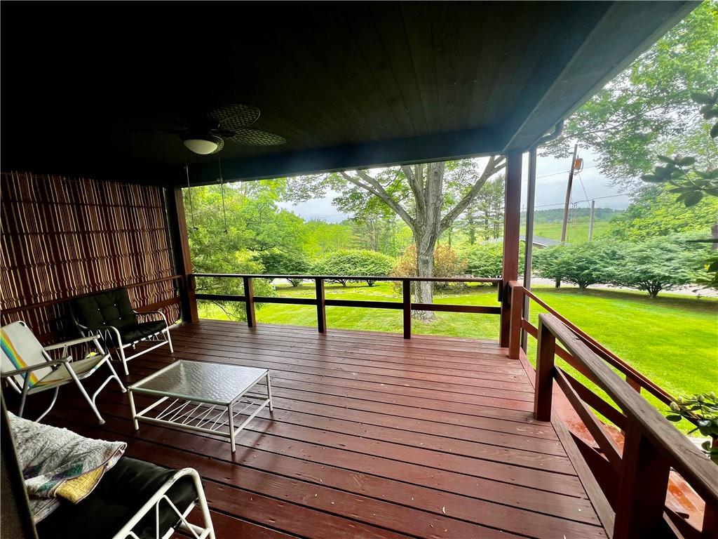 a view of a patio with wooden floor