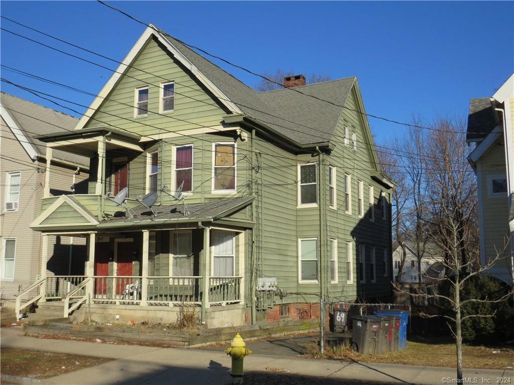 a front view of a house with parking area