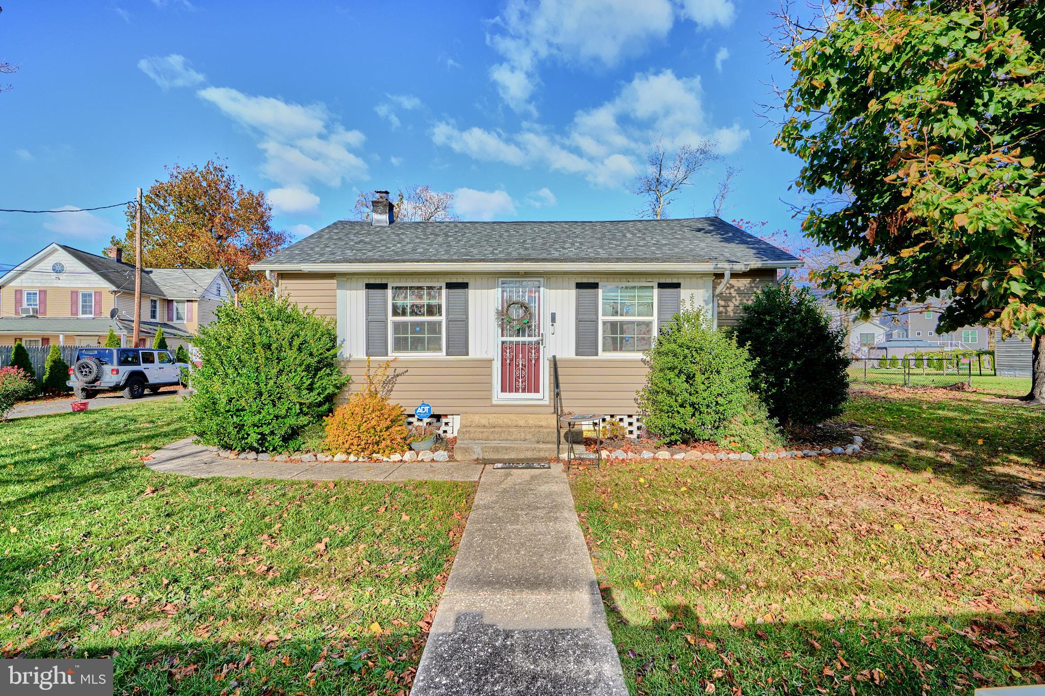 a view of house with yard