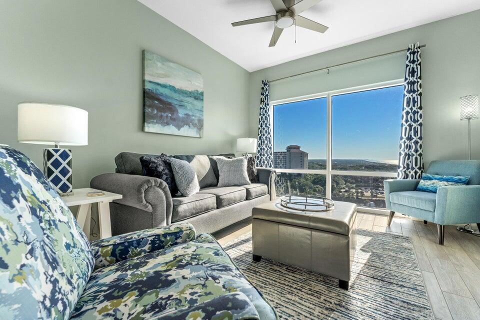 a living room with furniture and a window