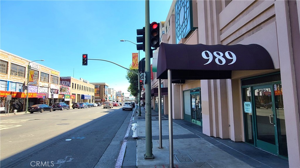 a view of a street with stores