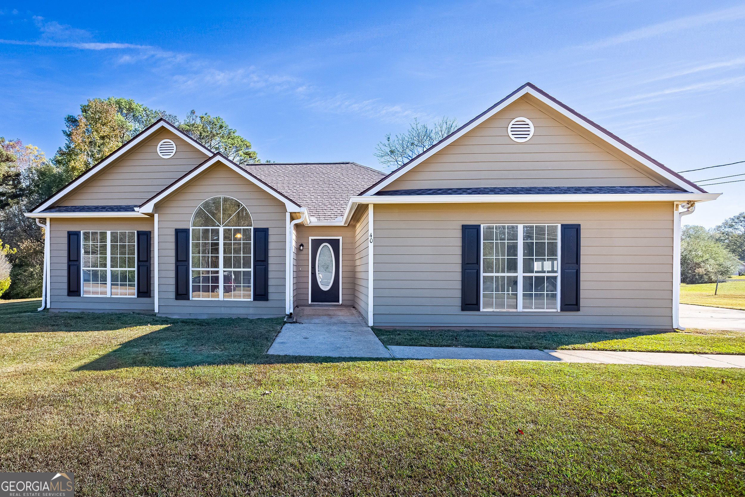 front view of a house with a yard