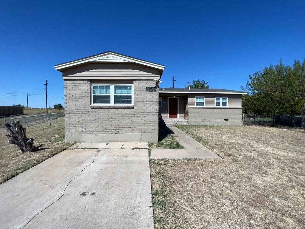 a front view of a house with parking area