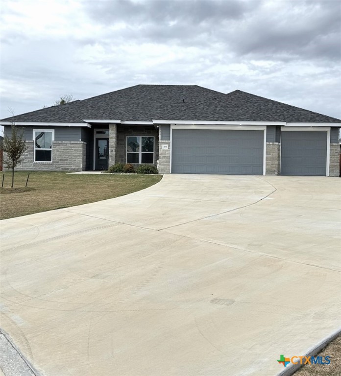 front view of a house with a yard