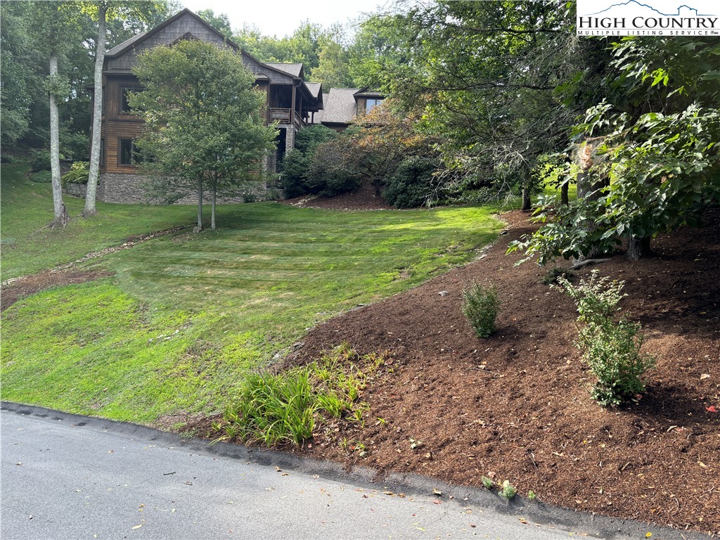 a backyard of a house with lots of green space