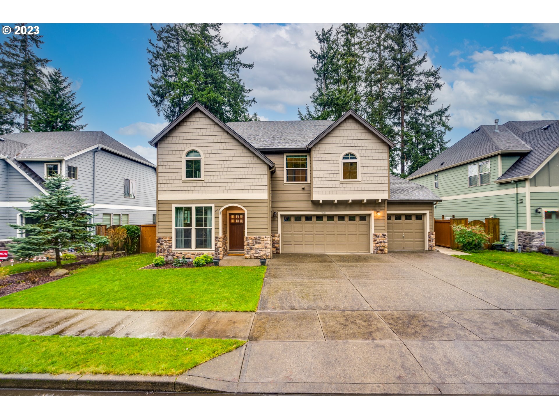 a view of house with yard and green space