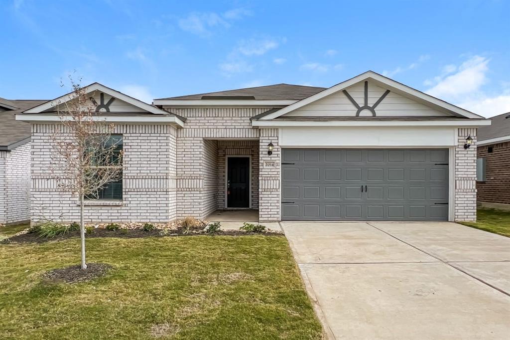 a front view of a house with garage