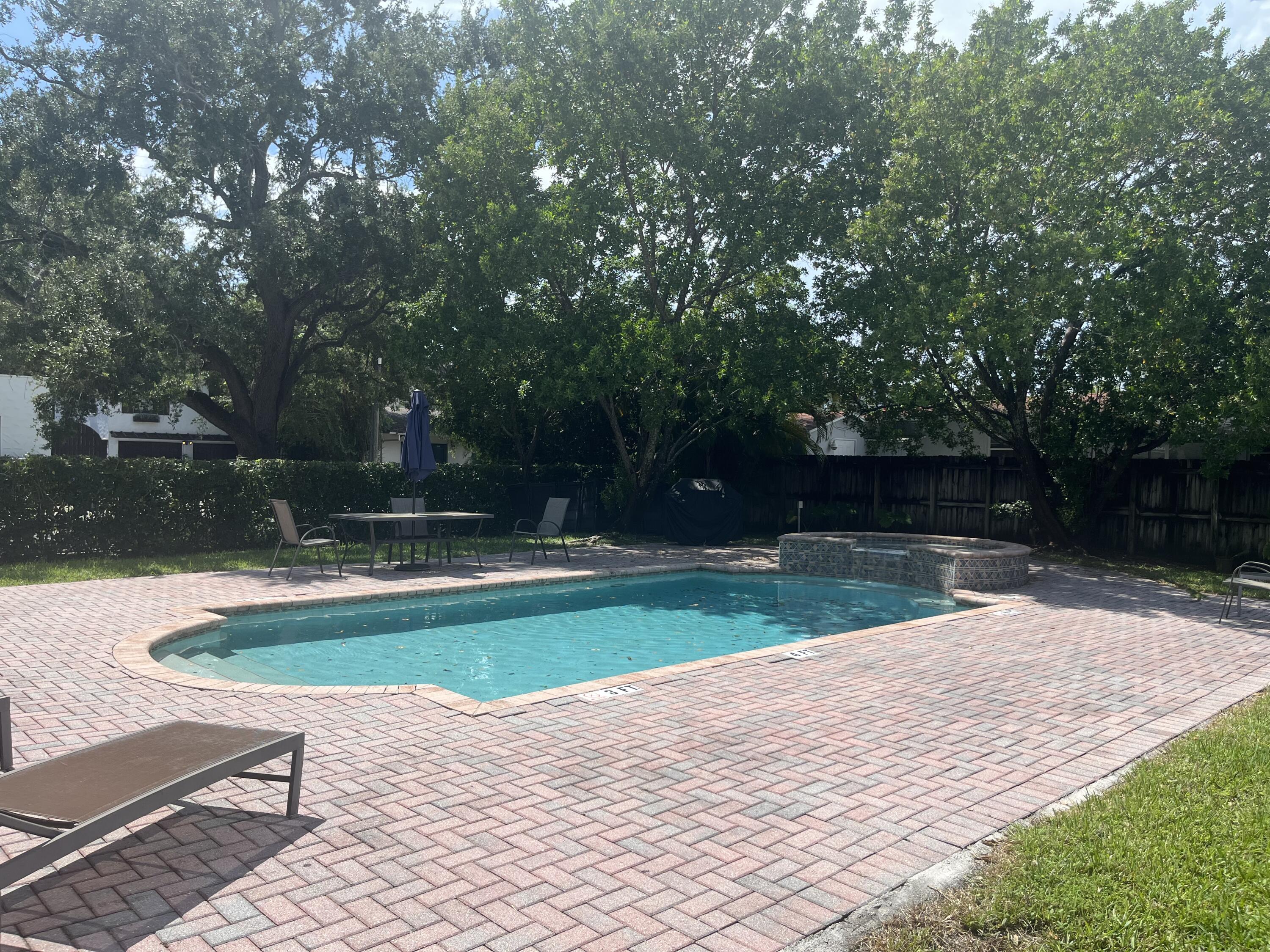 a swimming pool with wooden fence