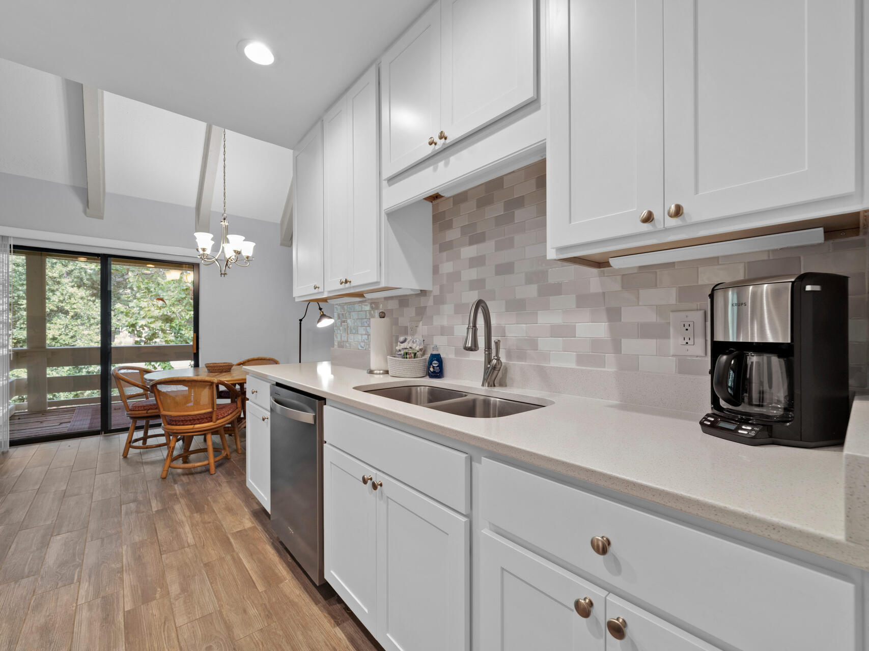 a kitchen with a sink and cabinets