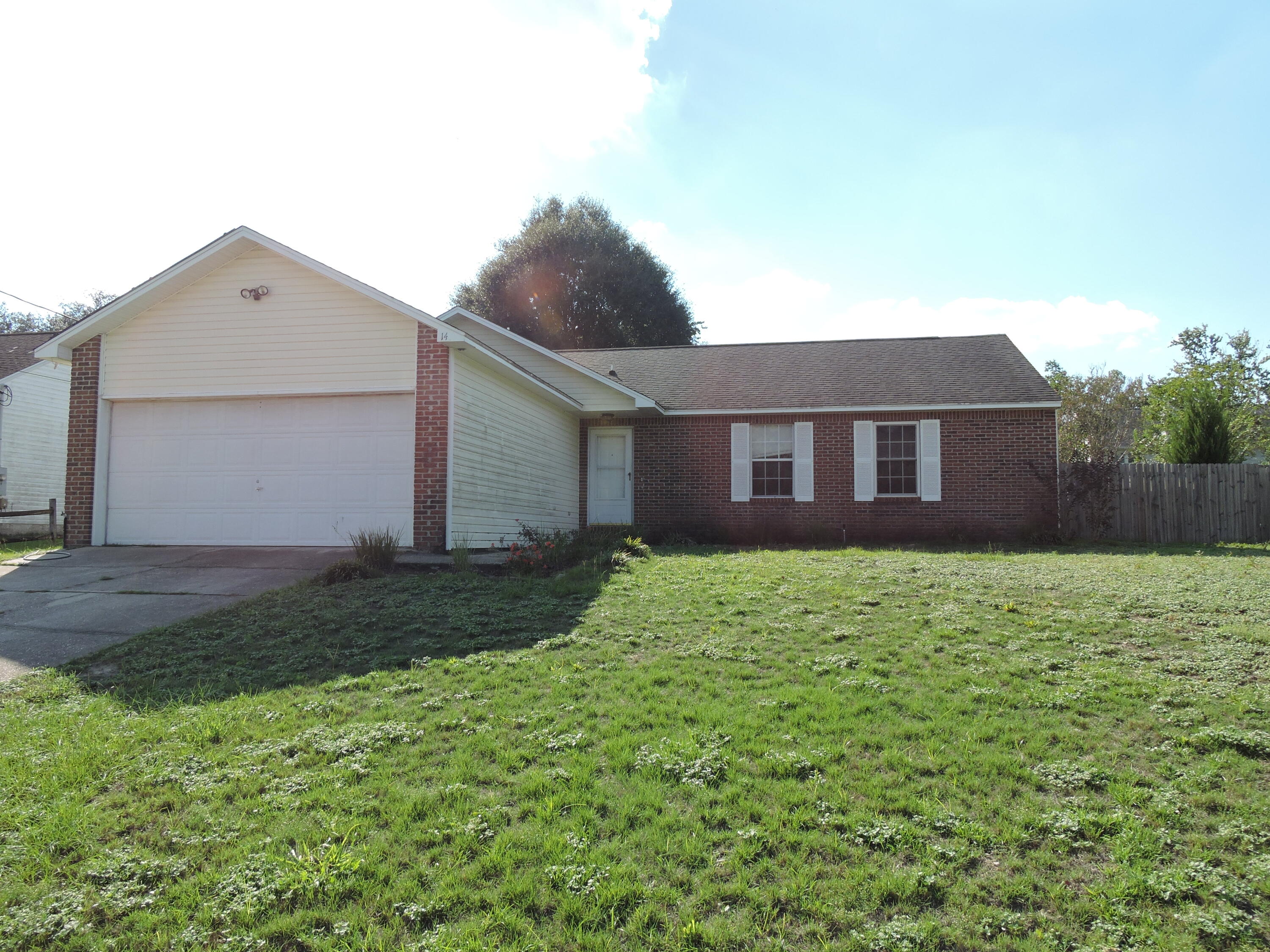 a brick house with a yard