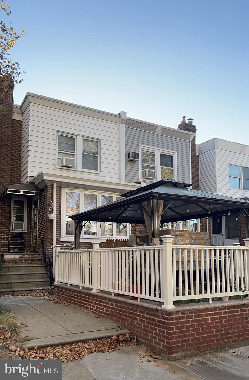 a view of a house with wooden deck