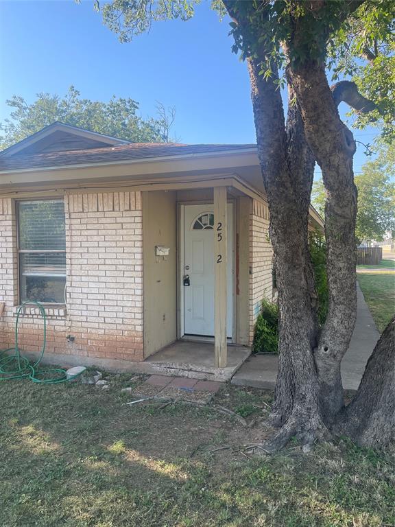 front view of a house with a small yard