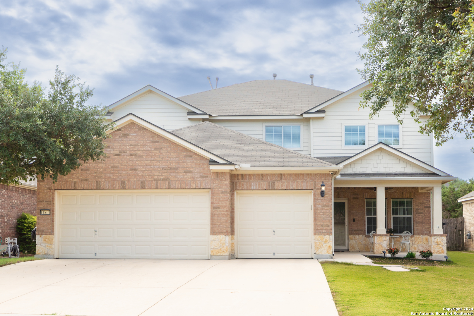 front view of a house with a yard