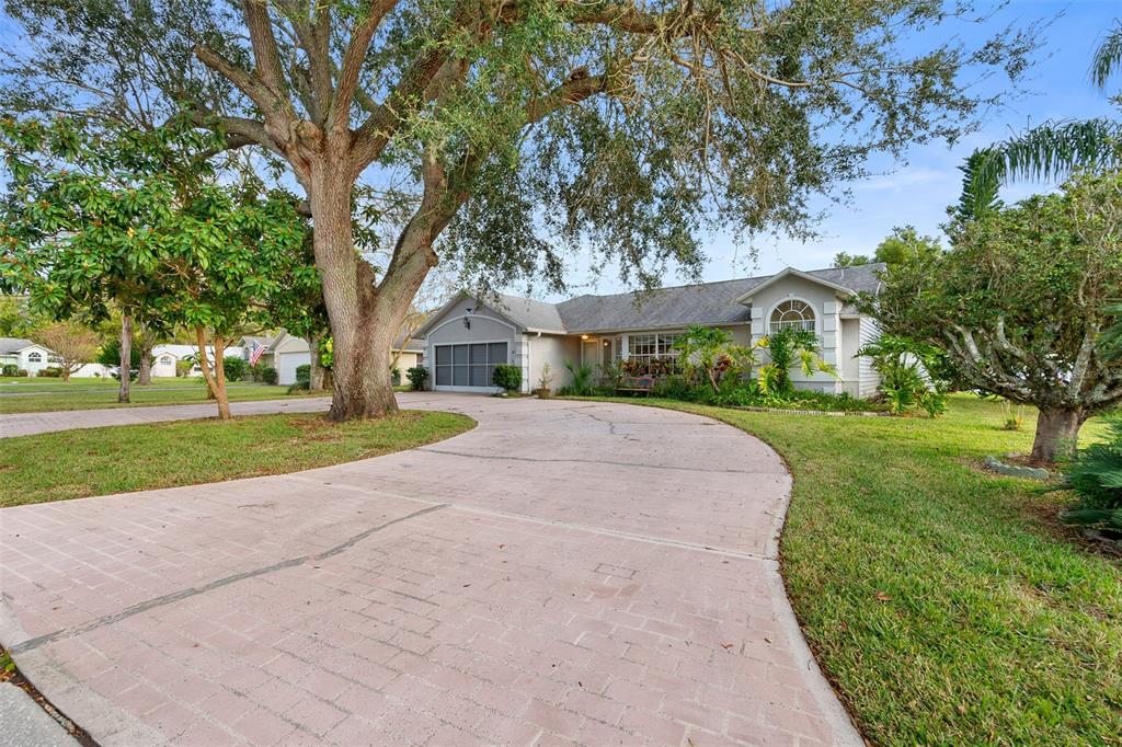 a view of a house with a yard