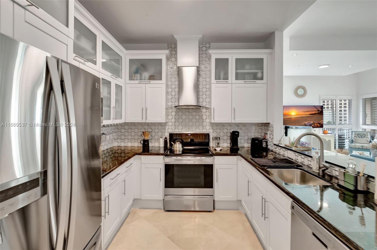 a kitchen with a sink stove and refrigerator