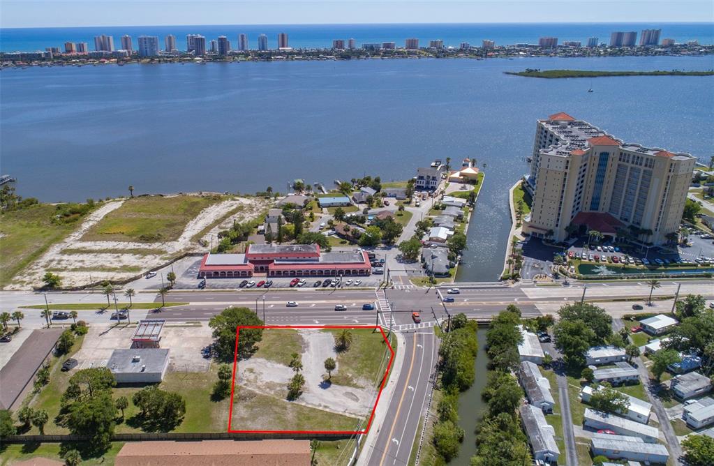 an aerial view of a house with a lake view