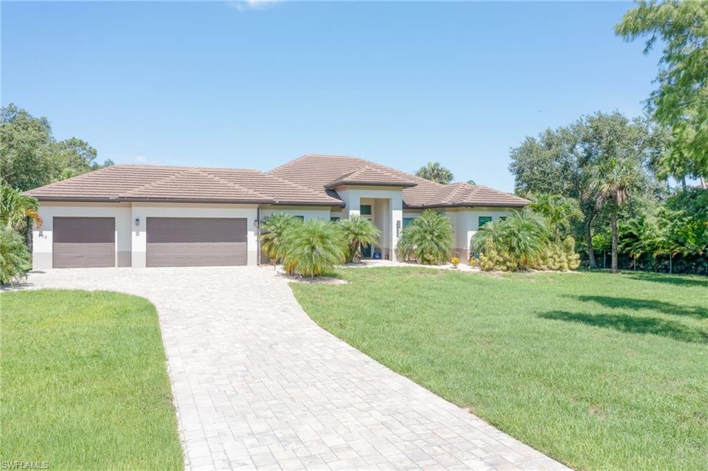 a front view of a house with a yard