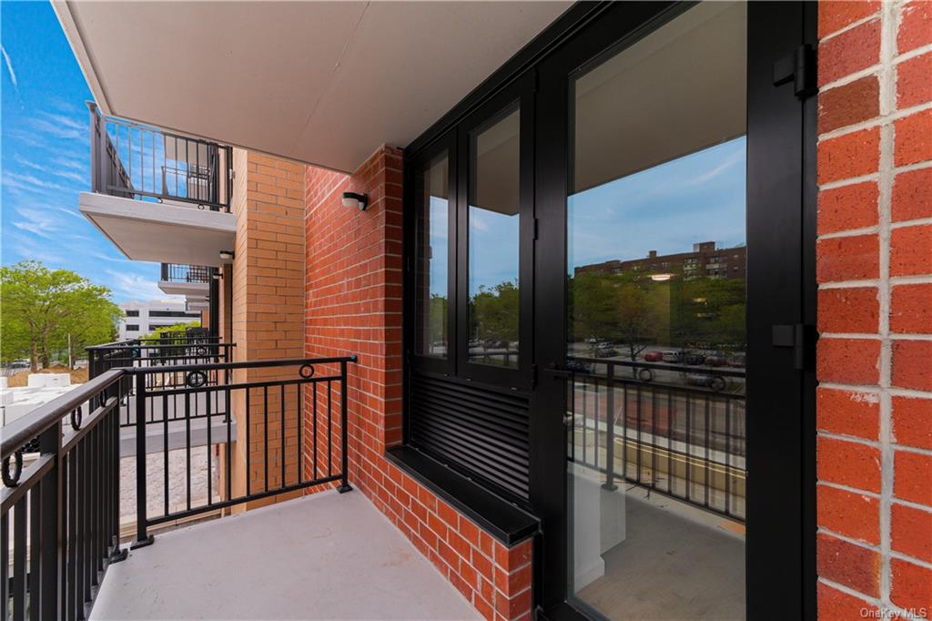 a view of a balcony with a potted plant