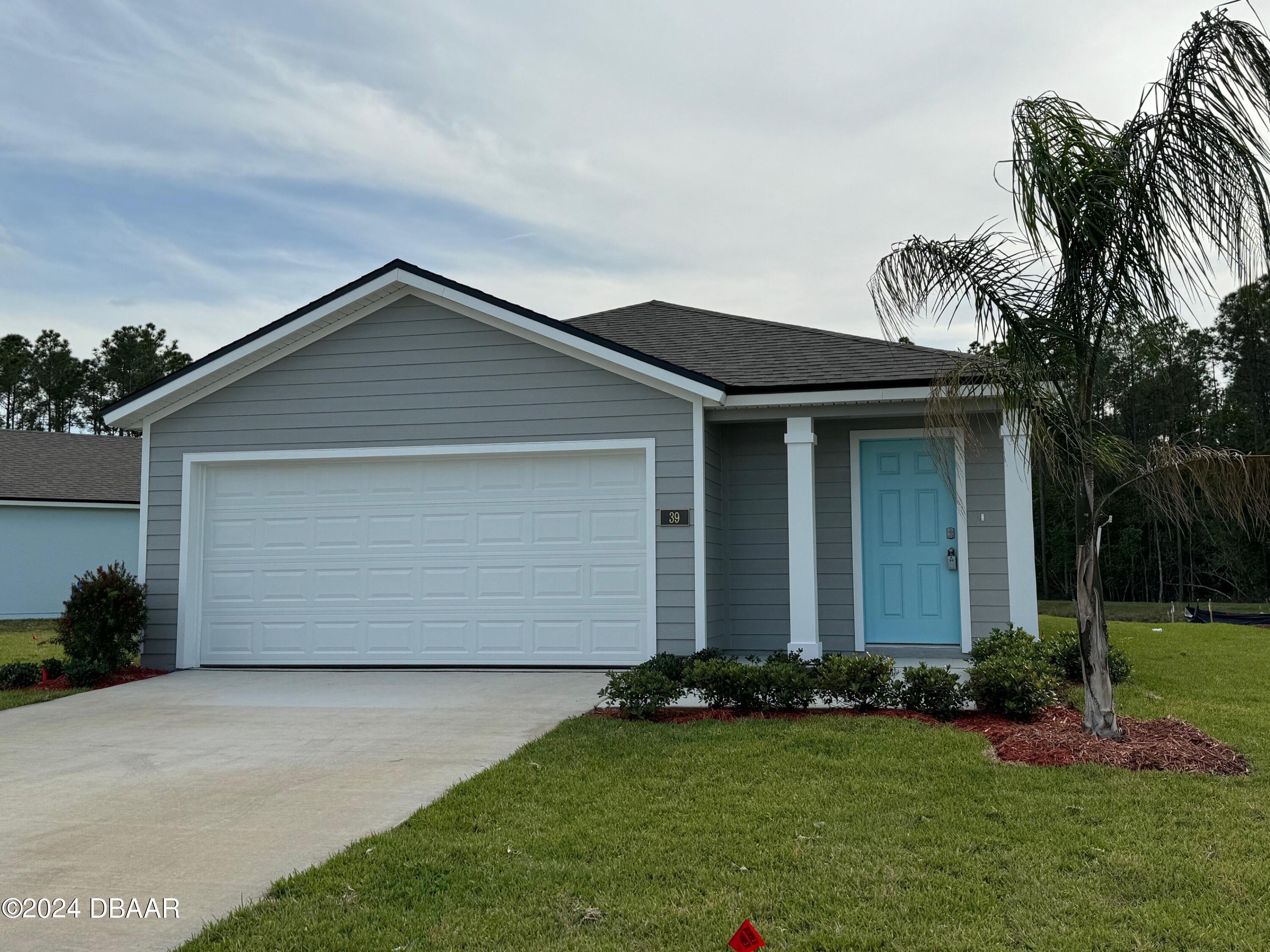 front view of house with a yard