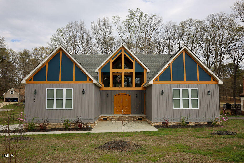 a front view of a house with a yard