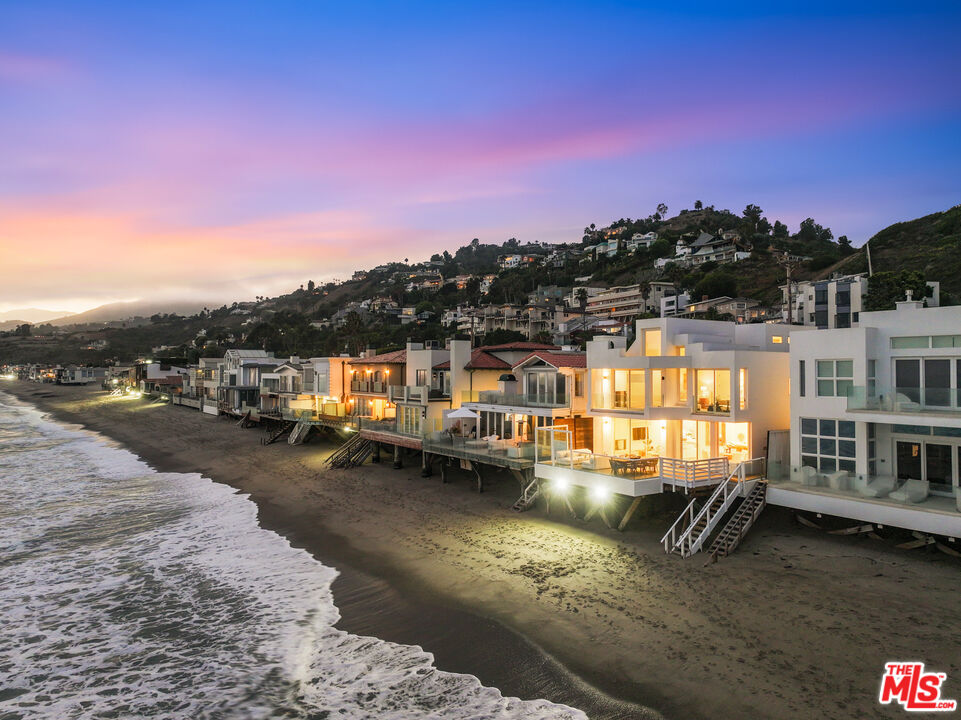 a front view of a house with a ocean view