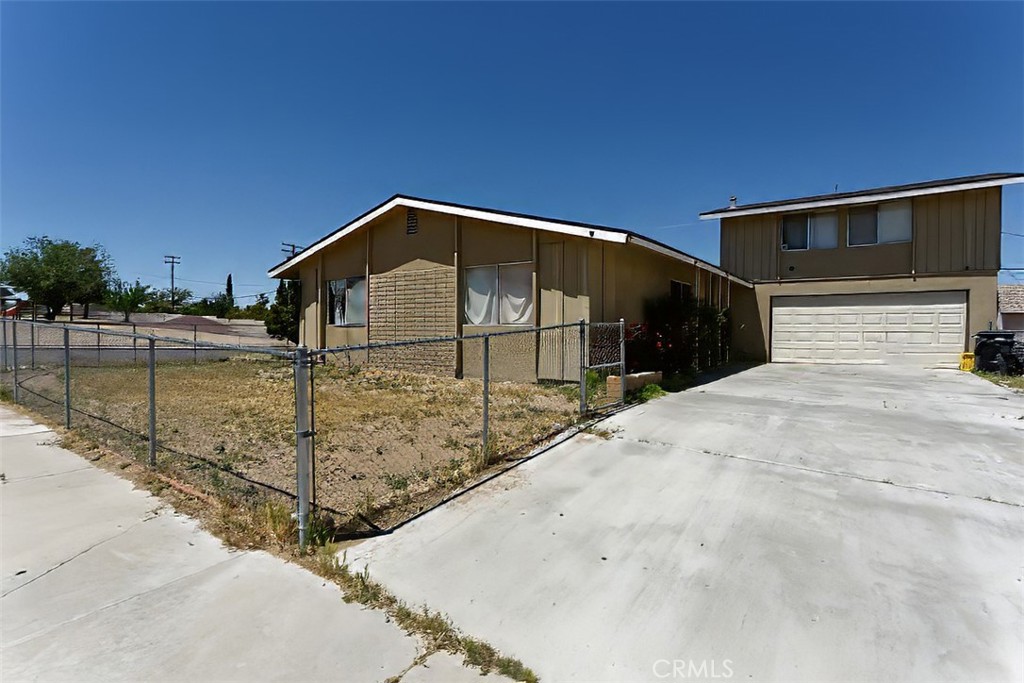 a front view of a house with a garage