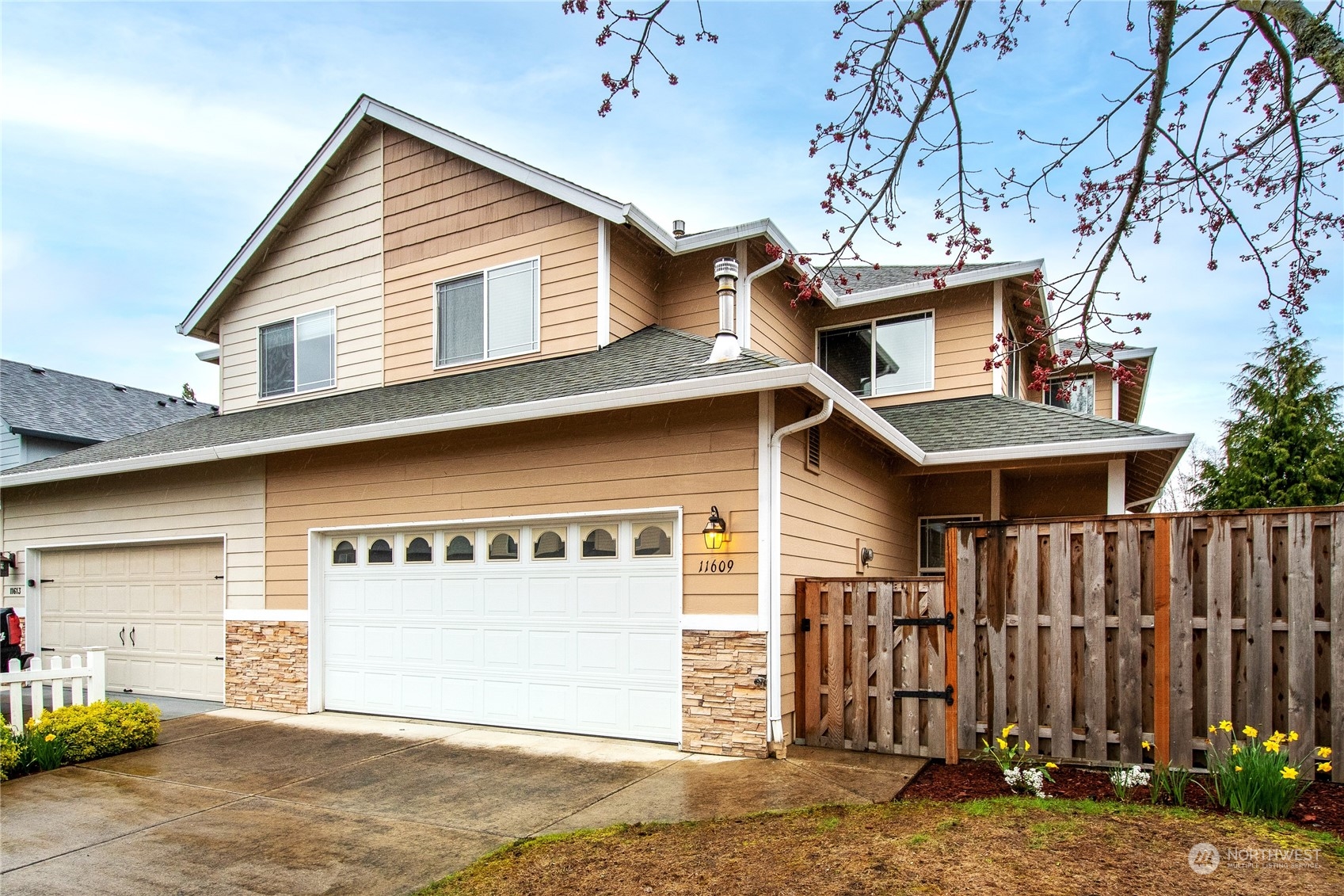 a front view of a house with a garage