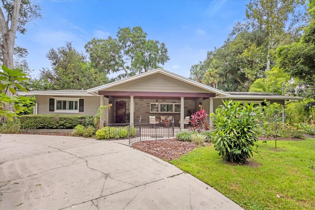 a front view of a house with garden