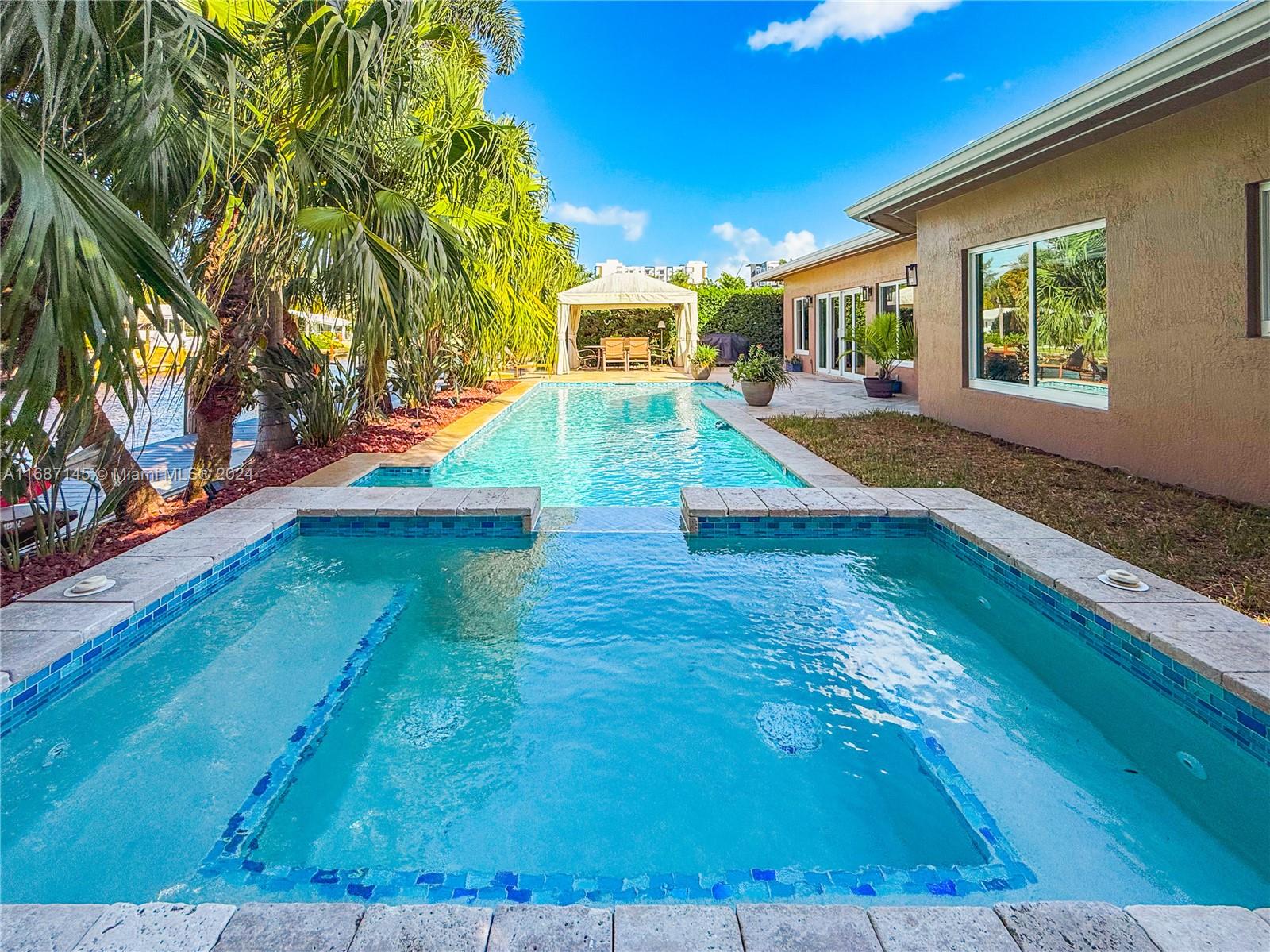 a view of a house with swimming pool