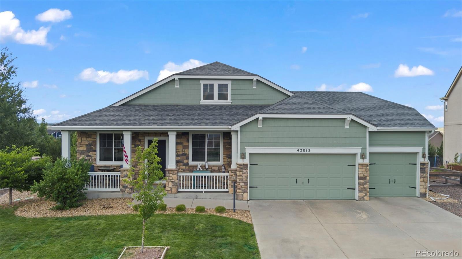 front view of a house with a yard