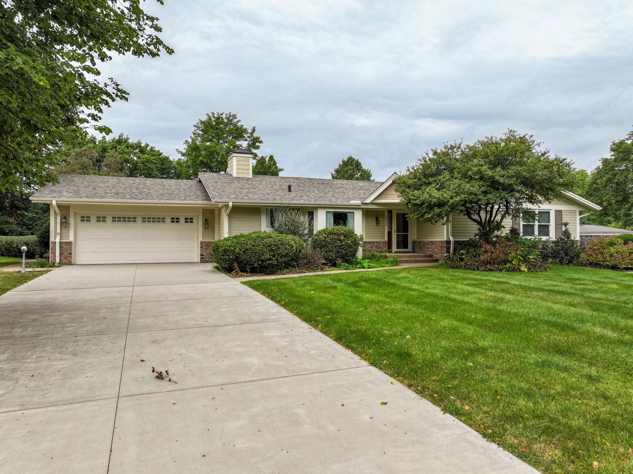 a view of house with yard