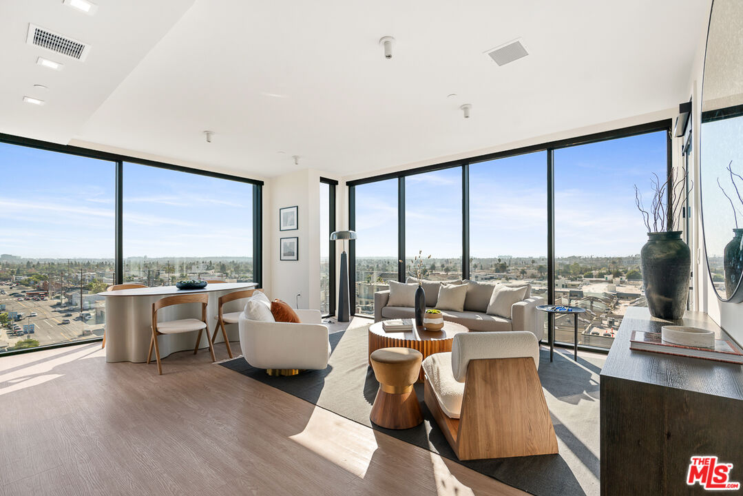 a living room with furniture large windows and view view