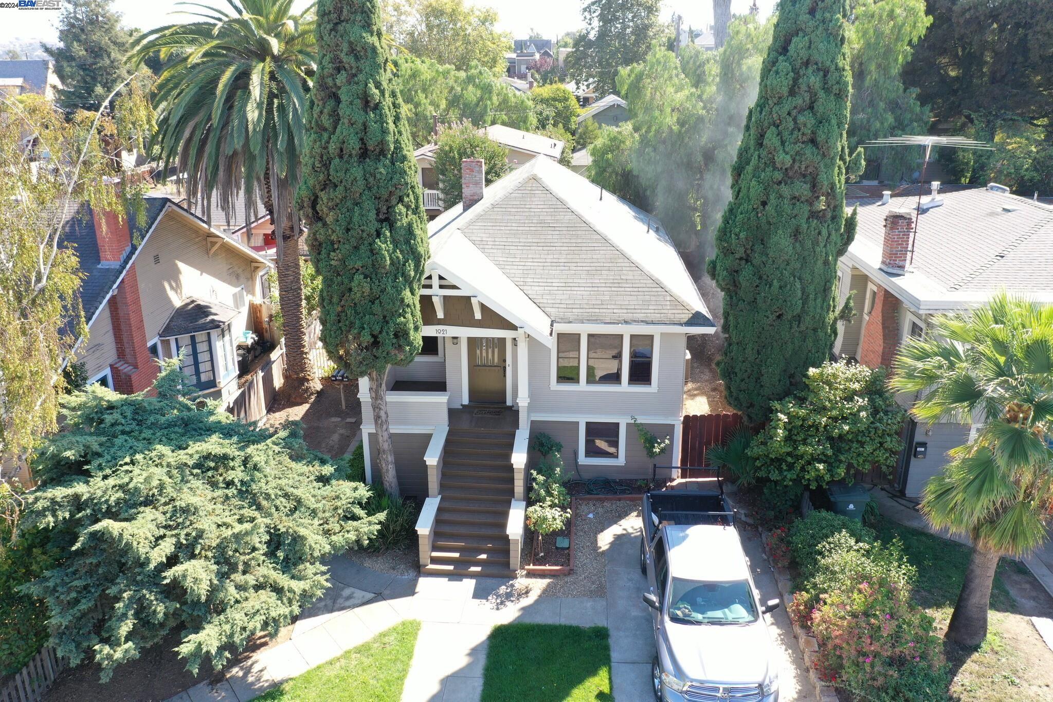 aerial view of a house with yard and green space