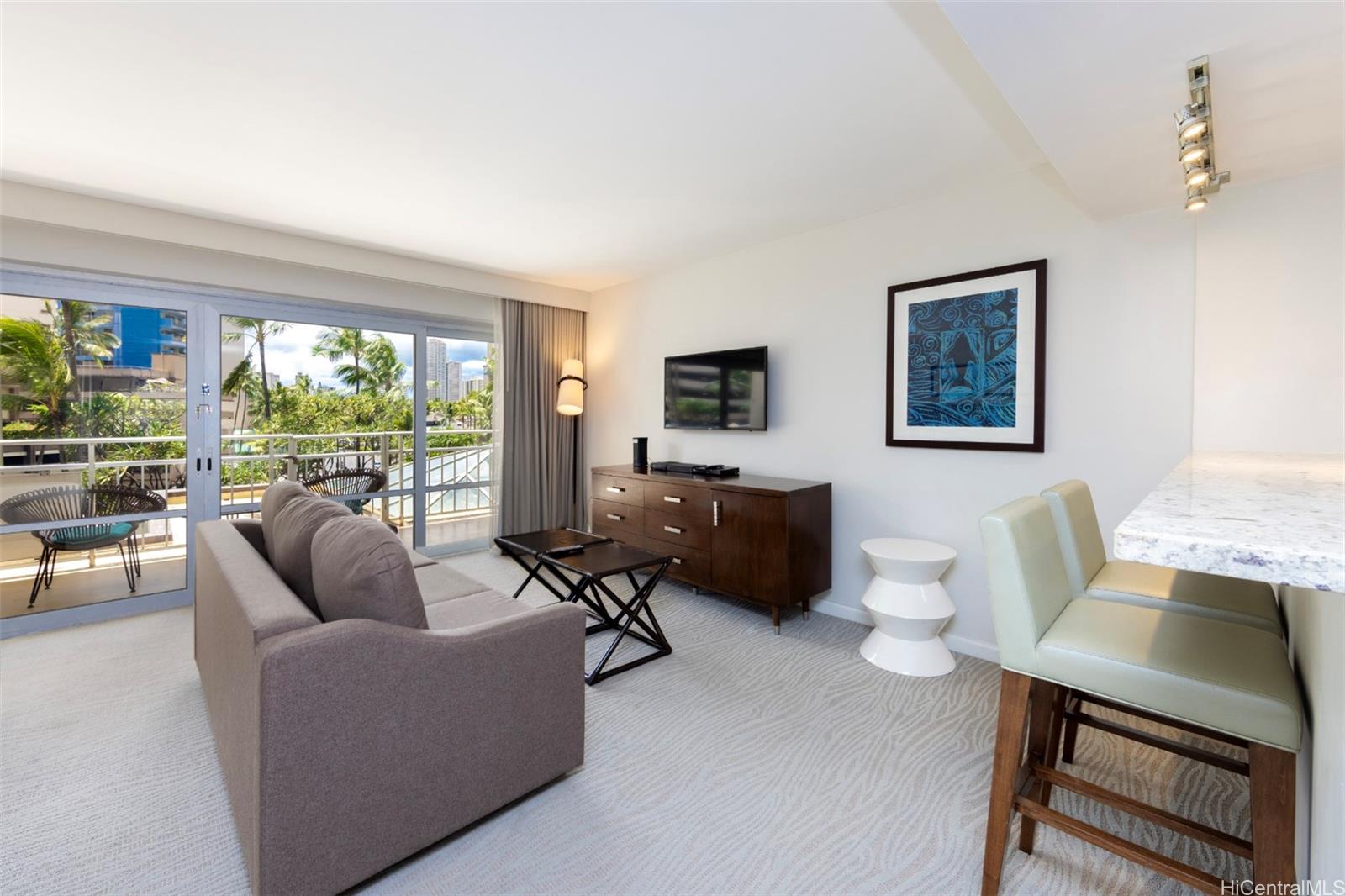 a living room with furniture and a flat screen tv