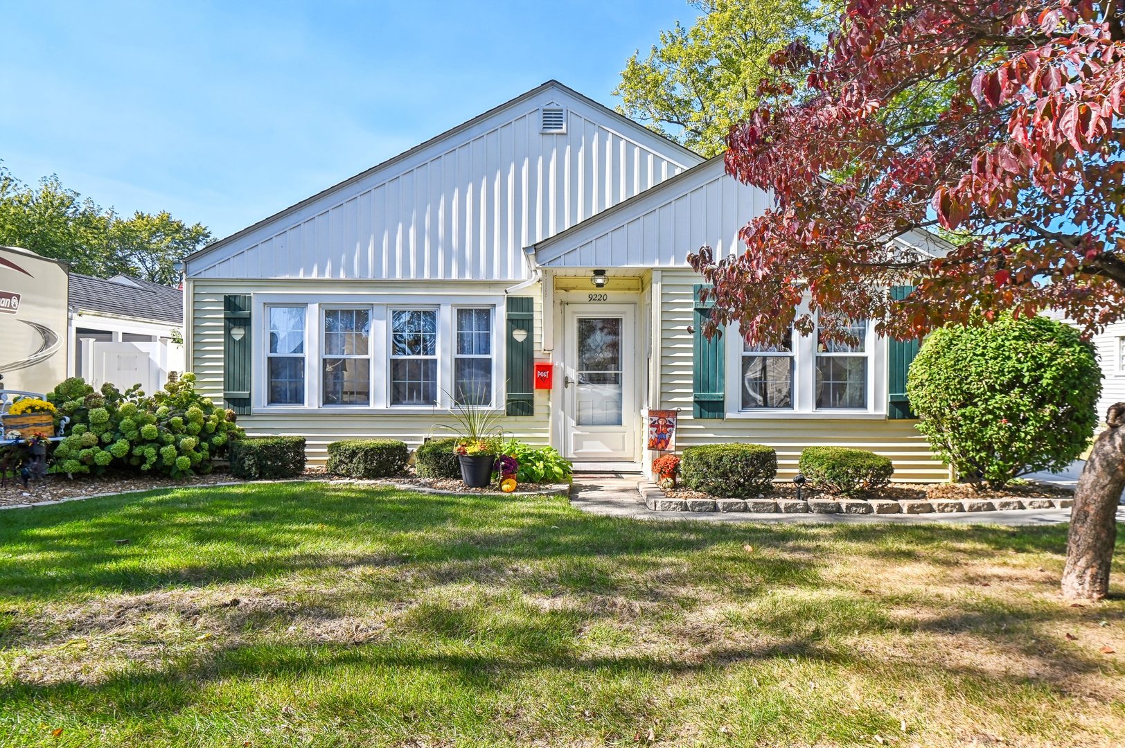 a front view of a house with a yard