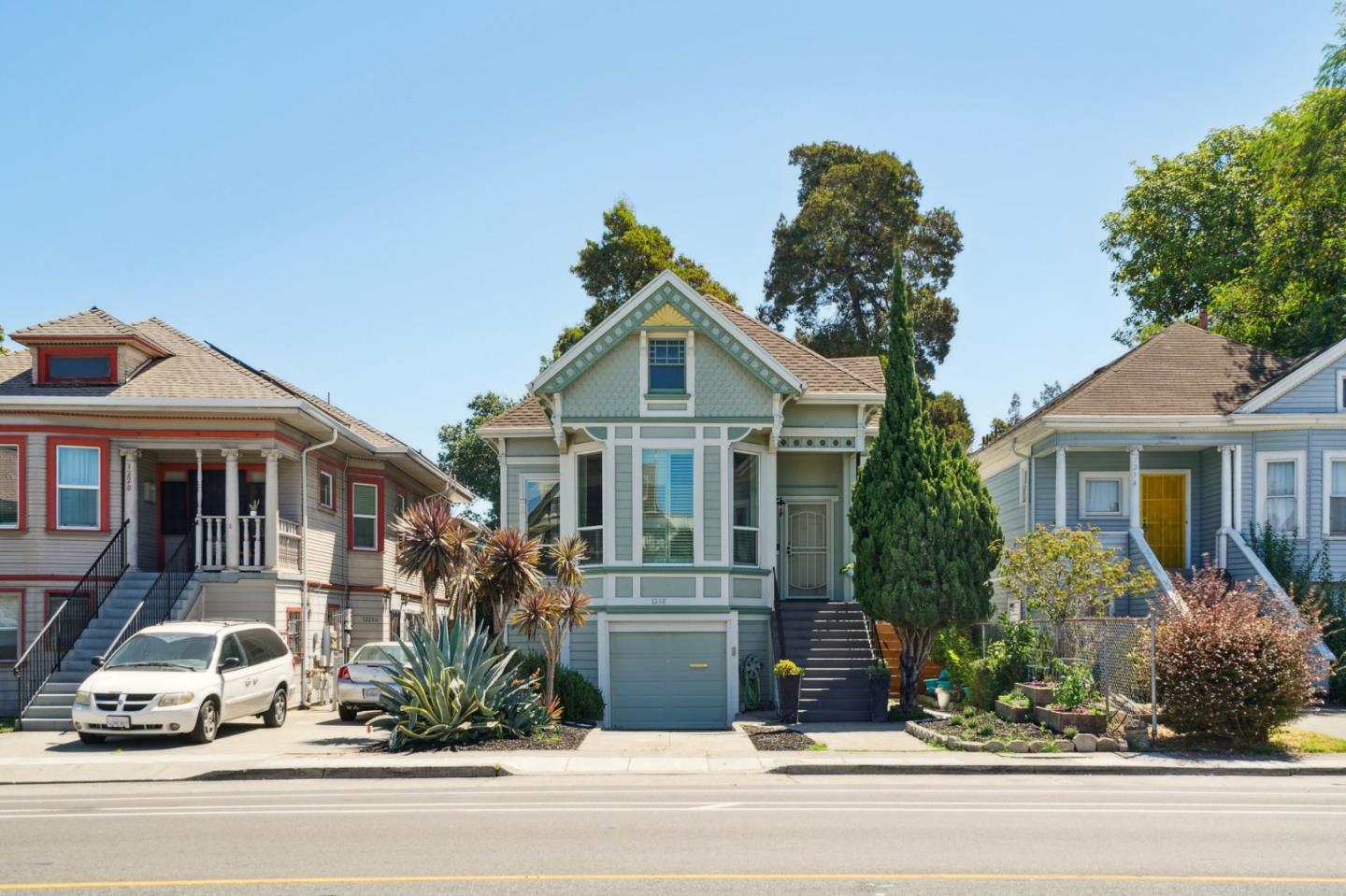 a front view of a house with a garden