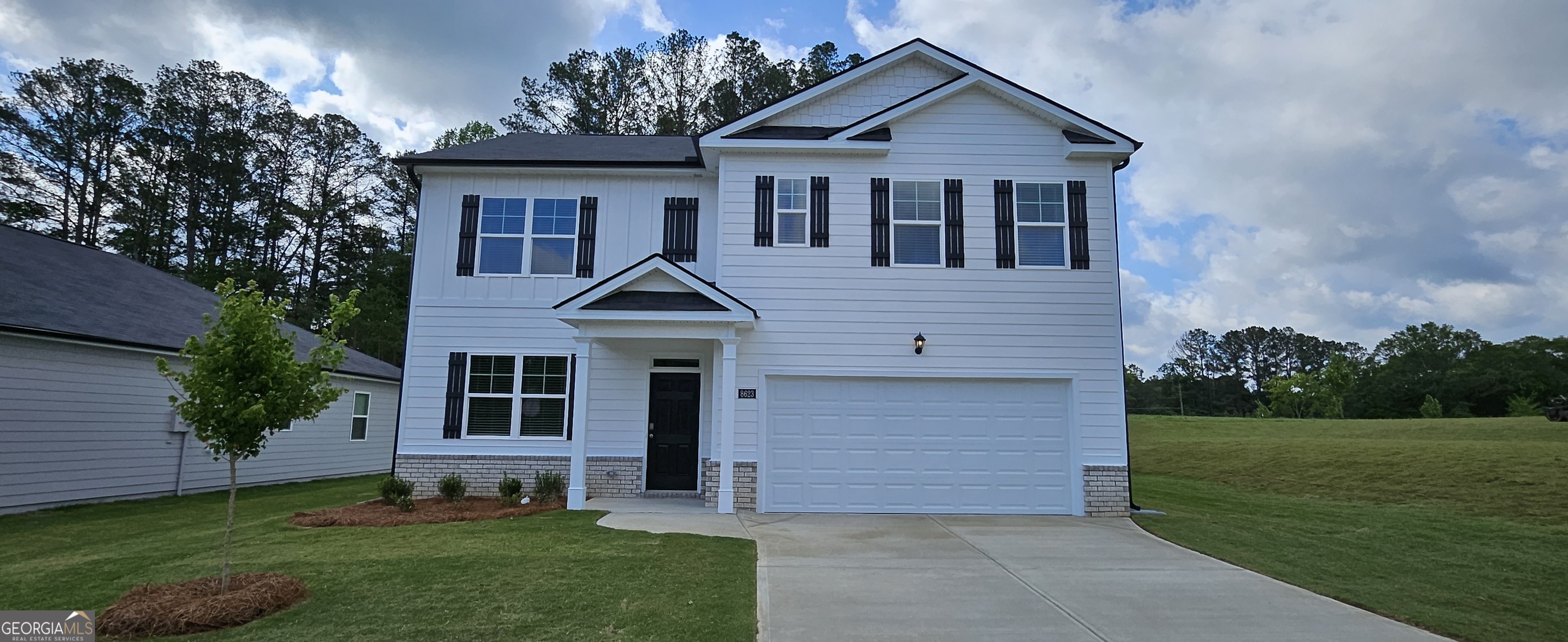 front view of a house with a yard