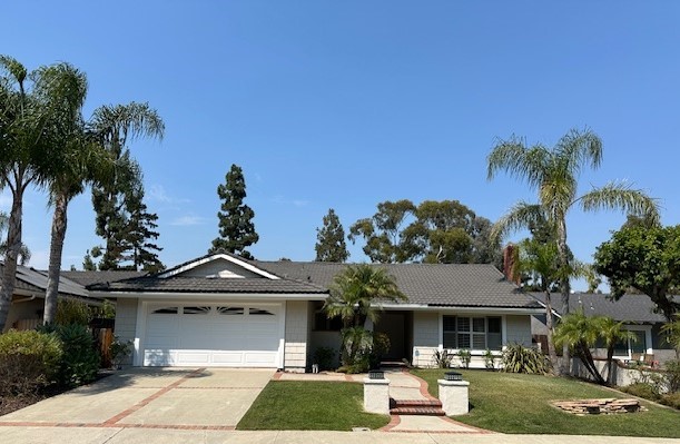 front view of a house with a yard